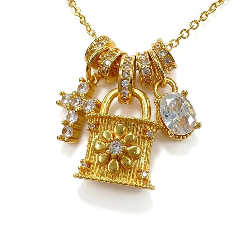 Close-up of the three gold charms