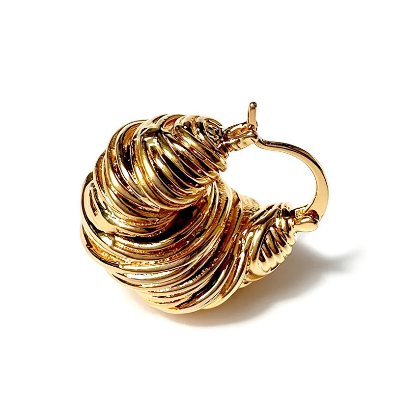 Sculpted wave hoops worn
