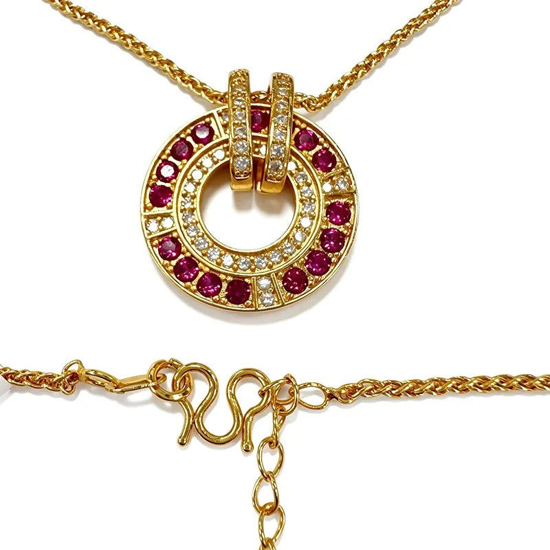 Close-up of the garnet-red stone halo ring